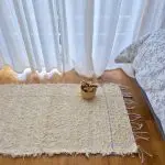 small cream rug with purple line L