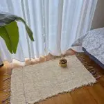 small cream rug with purple lines