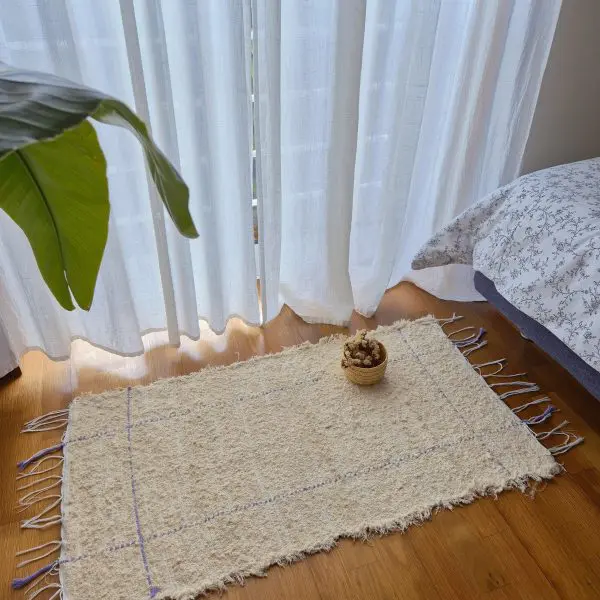 small cream rug with purple lines