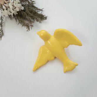 yellow ceramic bird