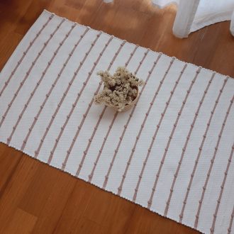 small white and old rose knotted rug