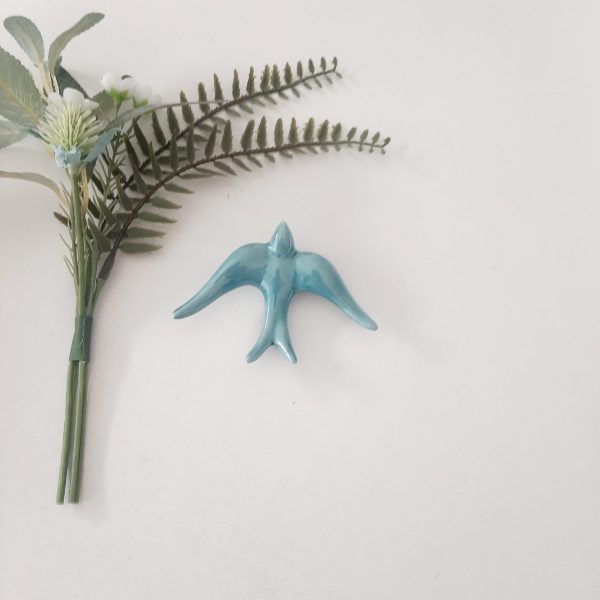 andorinha azul-petróleo vidrada pequena