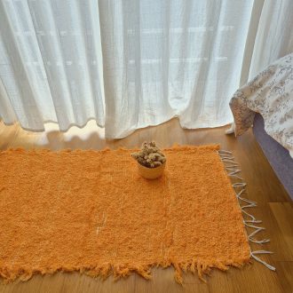 small orange rug made in recycled cotton