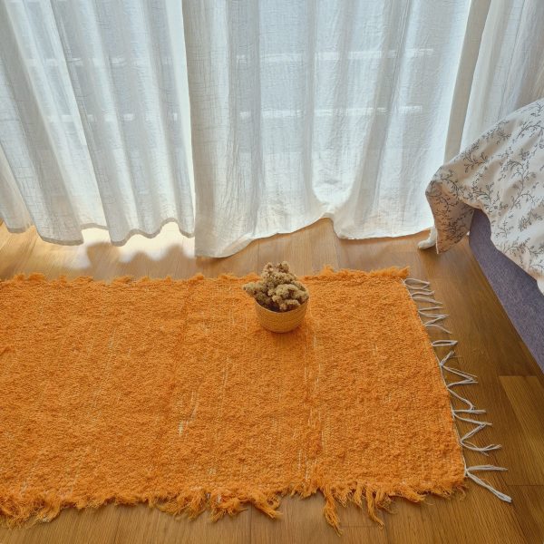 small orange rug made in recycled cotton