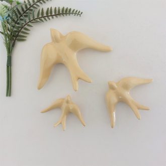pastel yellow ceramic bird