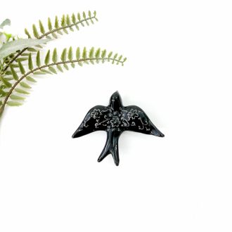 small ceramic black bird