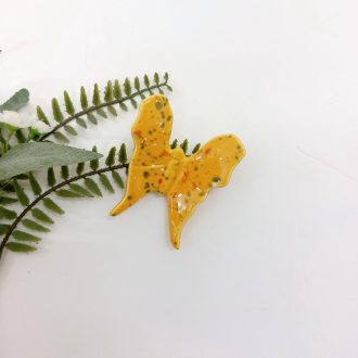 borboleta de cerâmica amarela