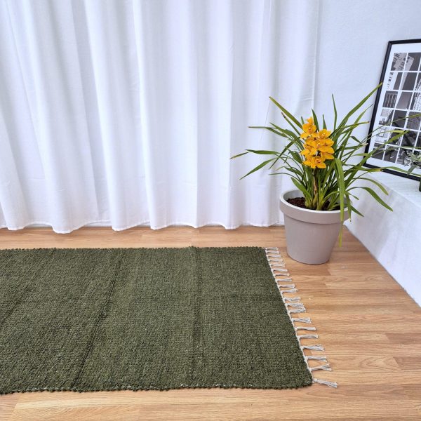 green area rug made with recycled materials