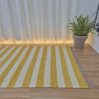 large yellow and cream rug made with textile waste