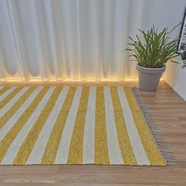 large yellow and cream rug made with textile waste