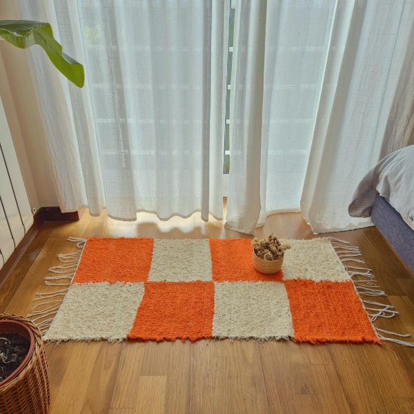 beige and orange checkered rug