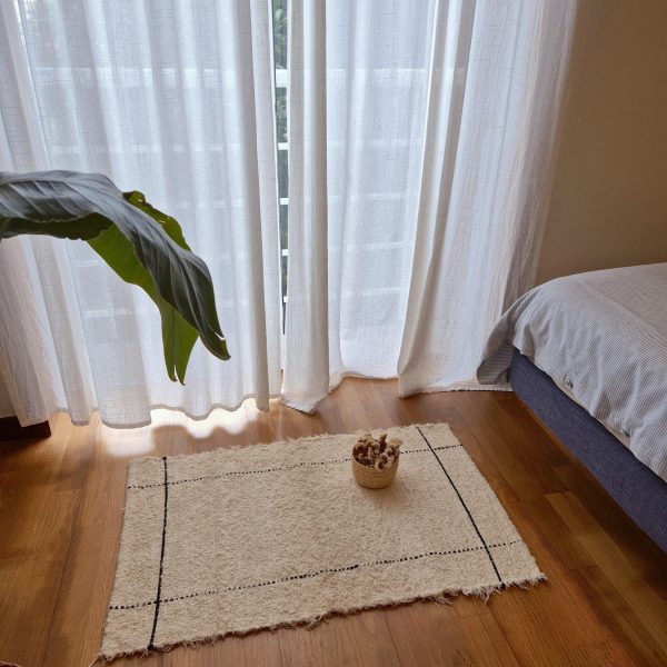 small rug with black rectangle