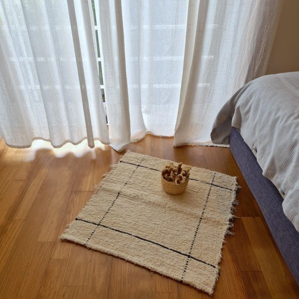 mini cream rug with black lines 2x2ft