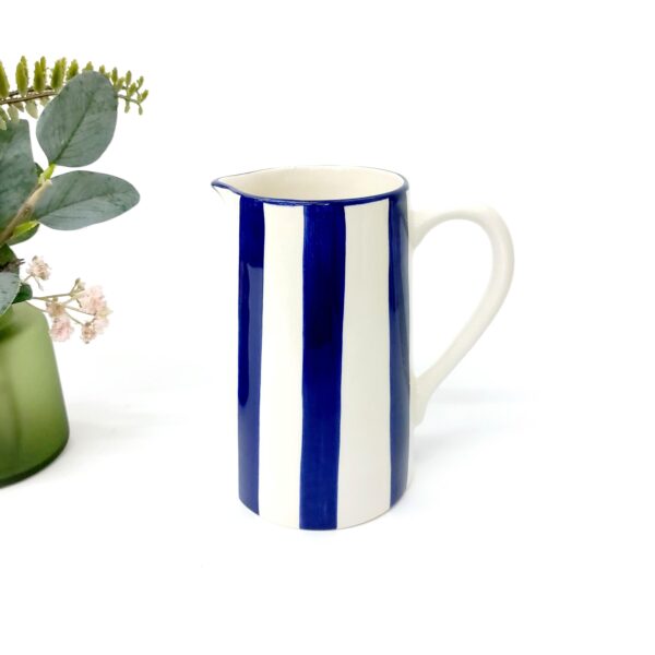 white pitcher with cobalt blue stripes