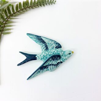 teal blue bird with relief