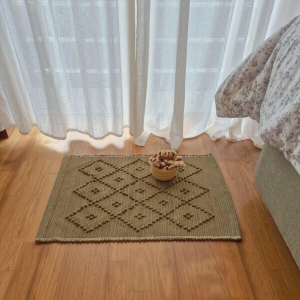 mini green rug with diamond knots